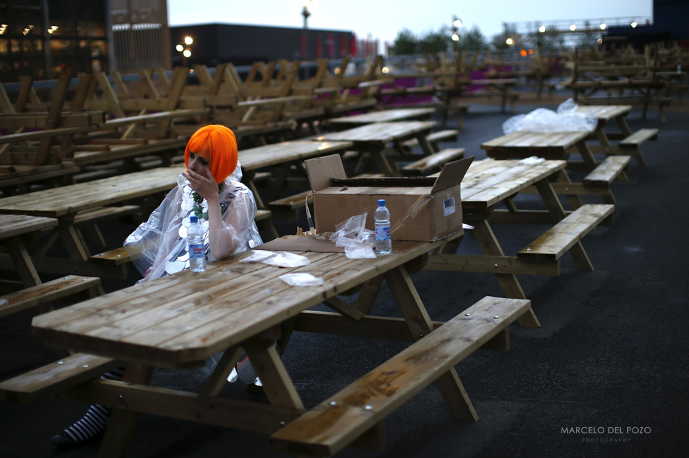 A performer sits as she wait before the start of the 2012 Olympic Games opening ceremony, next to the Olympic Stadium at the Olympic Park in London
