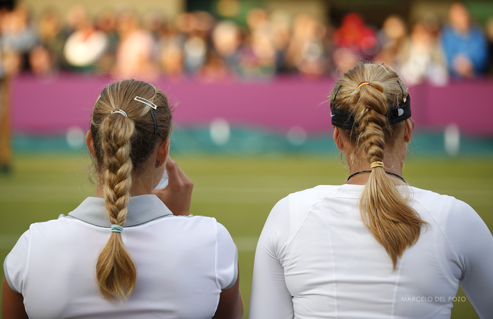 Germany's Lisicki and Kerber rest during break in their women's doubles tennis match against Serena and Venus Williams of the U.S. at the All England Lawn Tennis Club during the London 2012 Olympic Games