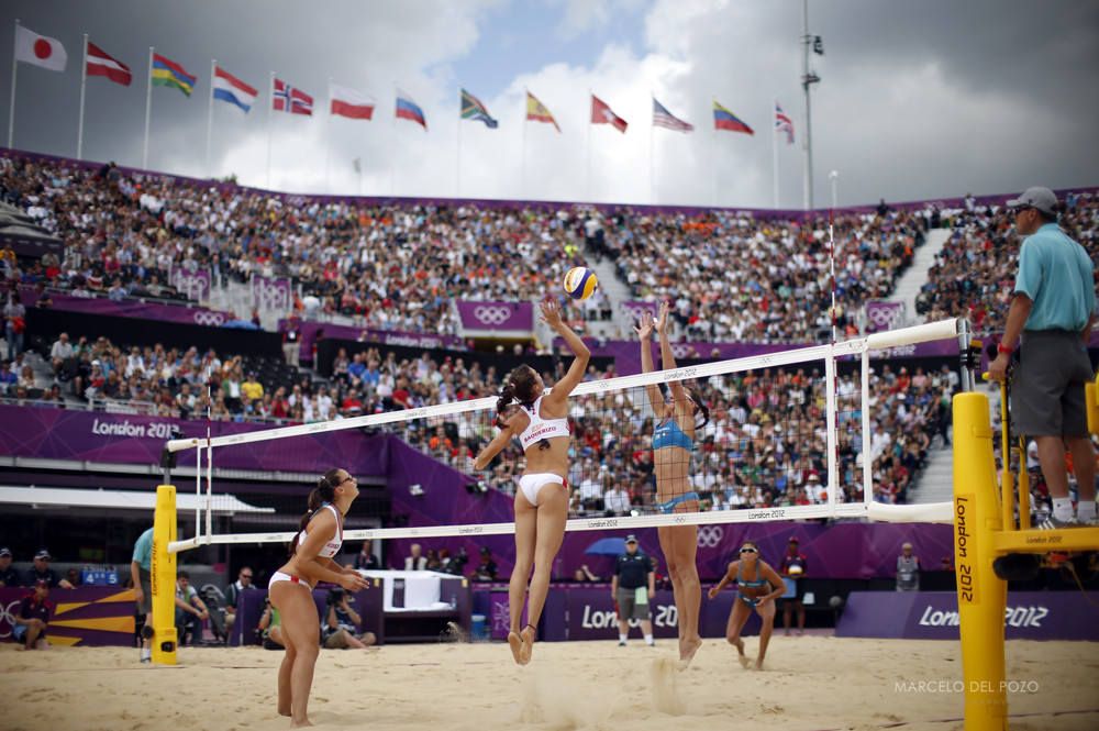 Italy's Greta Cicolari and Marta Menegatti compete against Spain's Liliana Fernandez Steiner and Elsa Baquerizo McMillan during their women's round of 16 beach volleyball match at Horse Guards Parade during the London 2012 Olympic Game