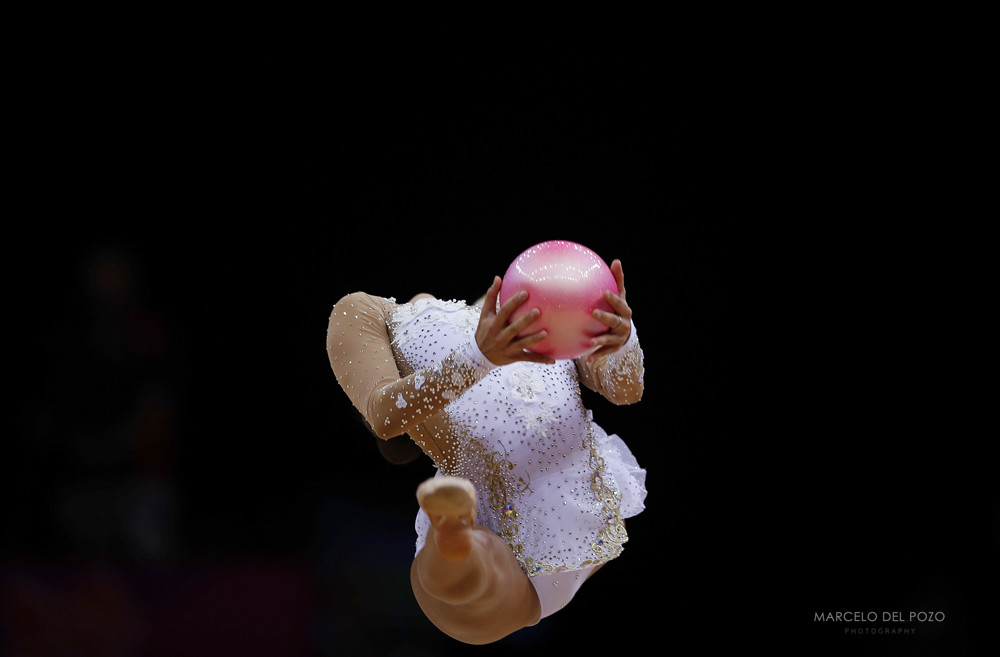 Russia's Evgeniya Kanaeva competes using the ball in the individual all-around rhythmic gymnastics final at the London 2012 Olympic Games