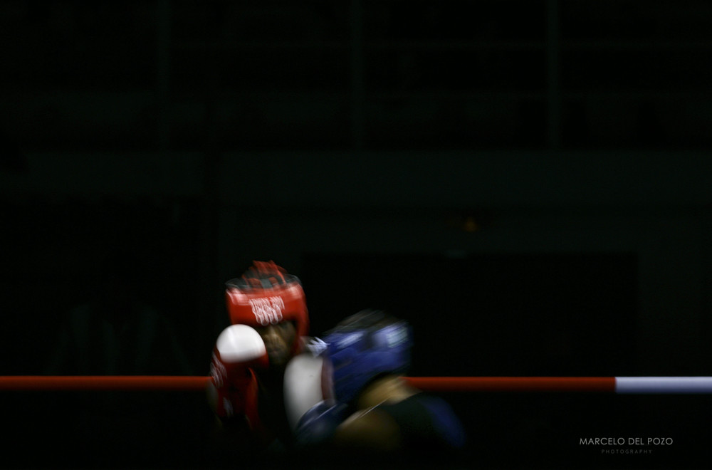 Haydarov of Uzbekistan and Ekpo of Nigeria fight during Olympic boxing bout in Athens.