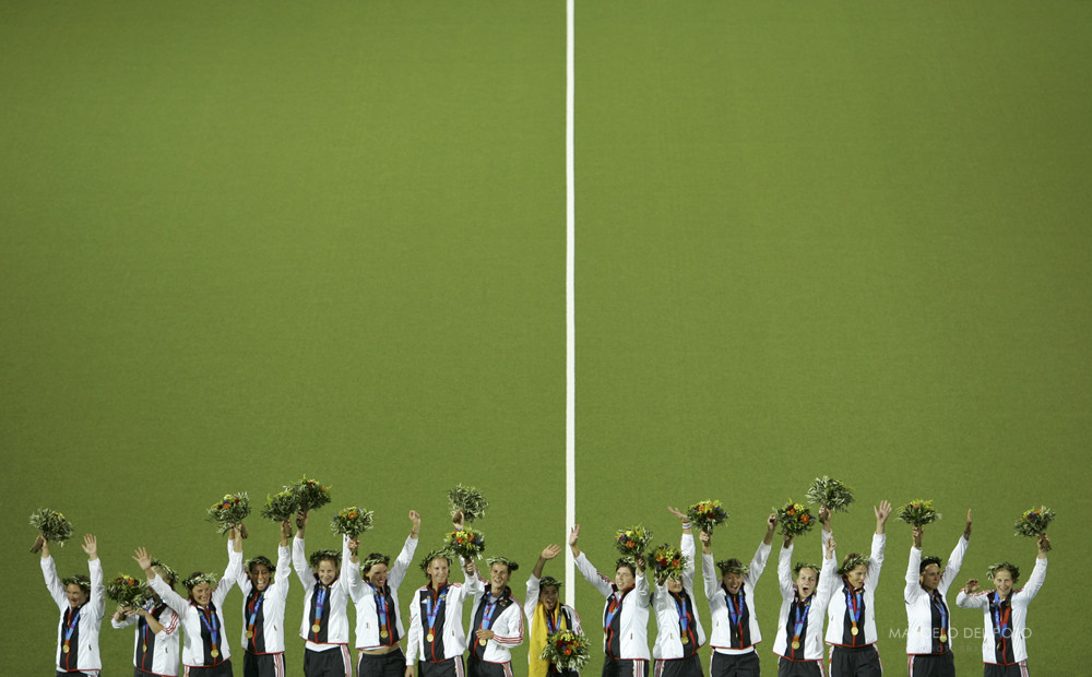 Germany's players celebrate celebrate on the podium after winning women's field hockey final match ...