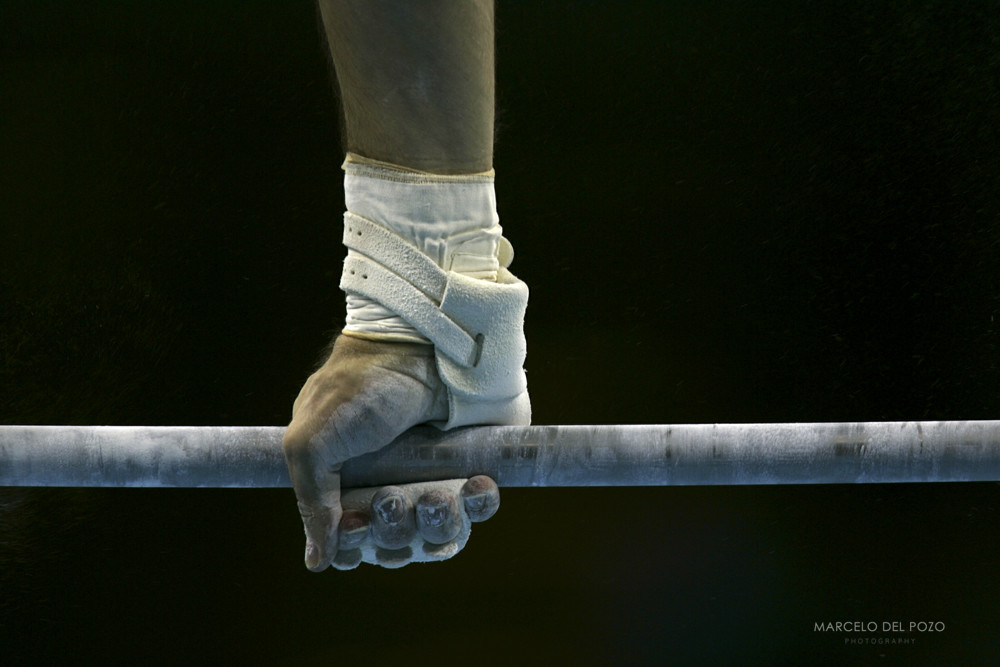 U.S. Brett McClure performs a routine on the horizontal bar during the men's artistic gymnastics dur..