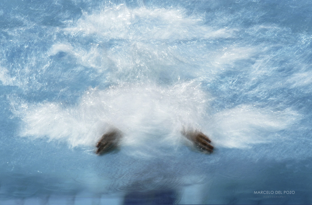 Michael Phelps from the U.S. swims in his 100 metres butterfly heat at the Athens 2004 Olympic Summe..