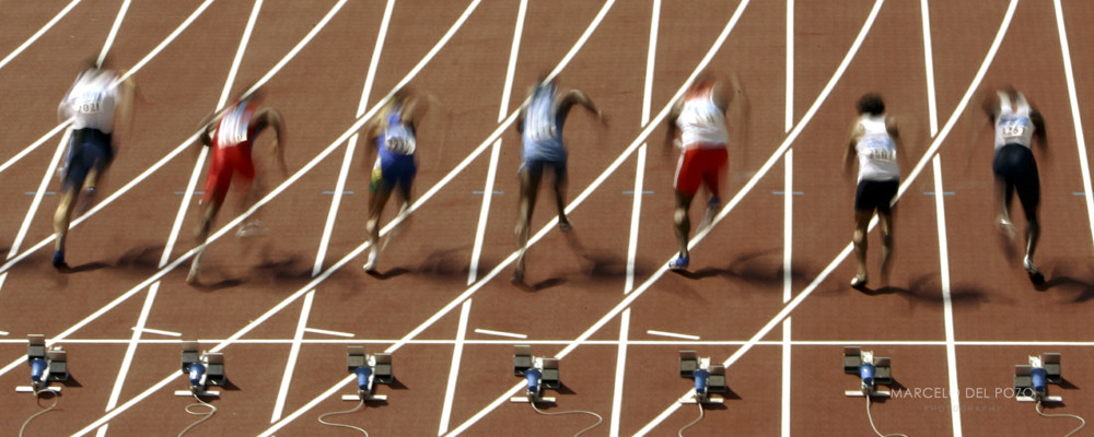 Athletes run during the men's 100 metres heats 3 at the Athens 2004 Olympic Summer Games August 21, ..