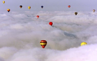 HOT AIR BALLOONS FLY OVER CLOUDS IN SEVILLE
